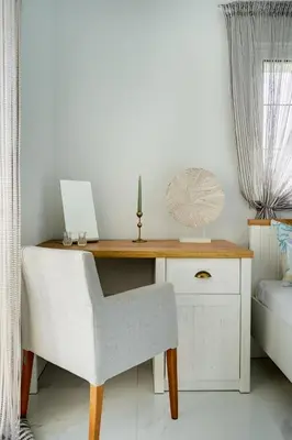 a desk with a chair and a laptop on it at Gia's Luxury Residence in Asgourou