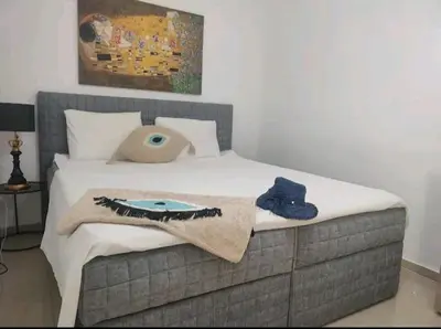 a bed with a blanket and a pillow on it at Sea view Holiday House Ialisos in Triánta