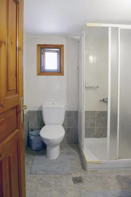 a bathroom with a toilet and a shower at Villa Magdalini in Halki
