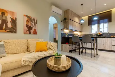 a living room with a couch and a table at Grande Terra in Kiotari