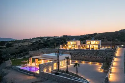 an aerial view of a house with lights at Athoros Luxury Villas in Afantou