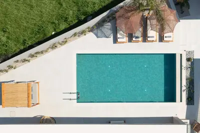 an overhead view of a swimming pool in a house at Golf Beach Villa in Afantou