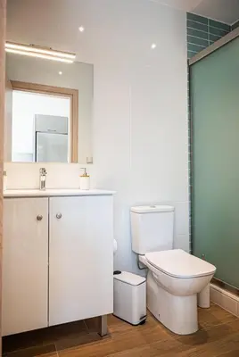 a bathroom with a toilet and a sink and a mirror at Rhodes Sunset House in Rhodes Town