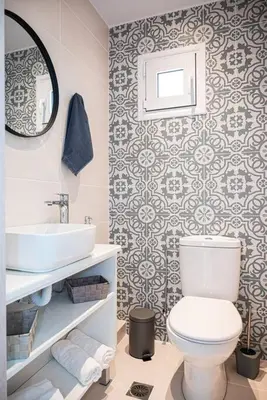 a bathroom with a white toilet and a sink at Rhodes Sunset House in Rhodes Town