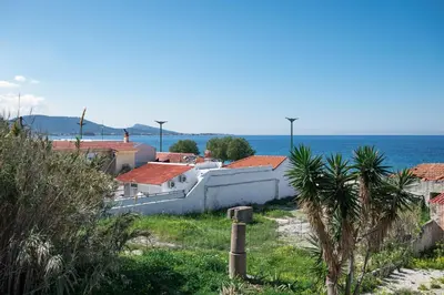a group of houses with the ocean in the background at Rhodes Sunset House in Rhodes Town