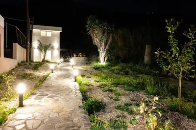 a row of lights in a yard at night at Rhodes Sunset House in Rhodes Town