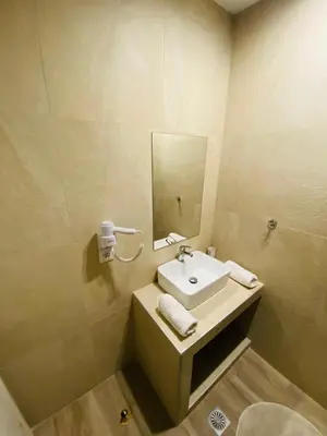 a bathroom with a sink and a mirror at Block66 in Rhodes Town
