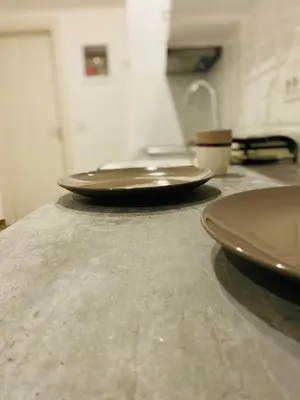 three brown plates sitting on top of a counter at Block66 in Rhodes Town