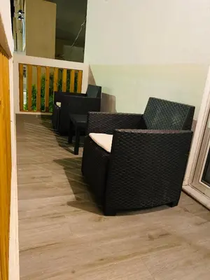a row of chairs and tables on a balcony at Block66 in Rhodes Town