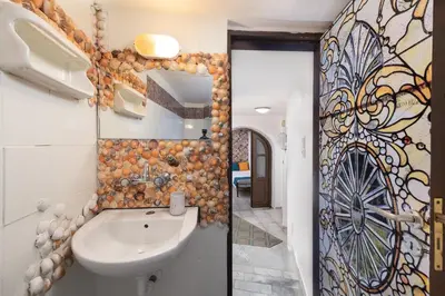 a bathroom with a sink and a mirror at Emerald Dream House, Aithria in Rhodes Town