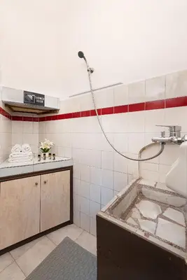 a bathroom with a tub and a sink at Emerald Dream House, Aithria in Rhodes Town
