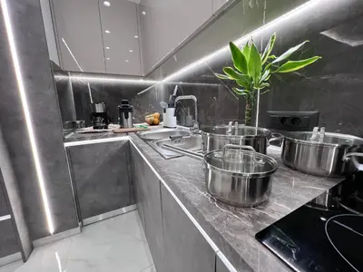 a kitchen with pots and pans on a counter at Odyssea Front Beach in Kremasti