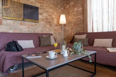 a living room with a couch and a coffee table at Gennadi Beach Front in Gennadi