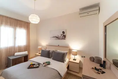 a bedroom with a bed with a tray on it at Gennadi Beach Front in Gennadi