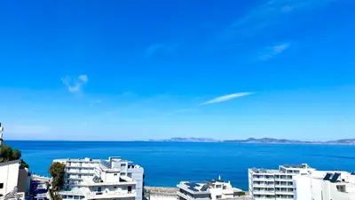 a view of a large body of water with buildings at TinyVibe - Downtown Seabreeze Studio in Rhodes Town