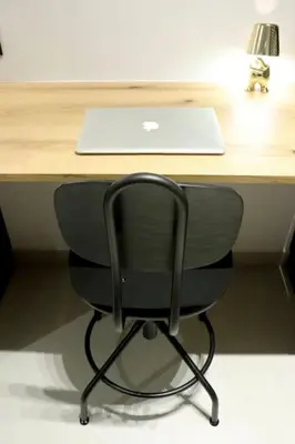 a desk with a chair with a laptop computer on it at TinyVibe - Downtown Seabreeze Studio in Rhodes Town