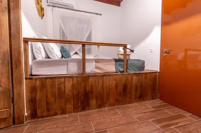 a room with a bunk bed with a window at Mascot Memories in Rhodes Town