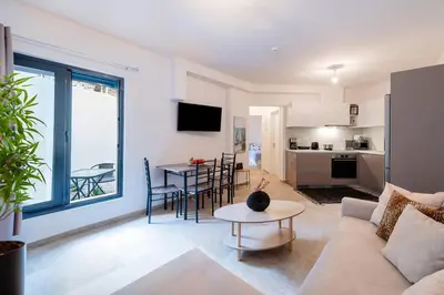 a living room with a couch and a table at Rhodes Center Apartment in Rhodes Town