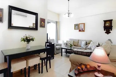 a living room with a couch and a table at Ivi CentralApartment Rhodes Town in Rhodes Town
