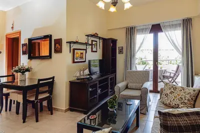 a living room with a couch and a table at Ivi CentralApartment Rhodes Town in Rhodes Town