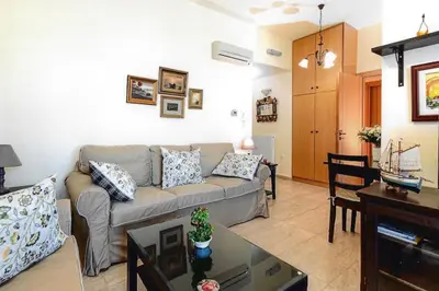 a living room with a couch and a table at Ivi CentralApartment Rhodes Town in Rhodes Town