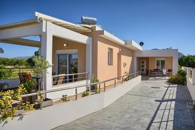 a villa with a view of the patio at Paul’s Garden Luxury House in Haraki