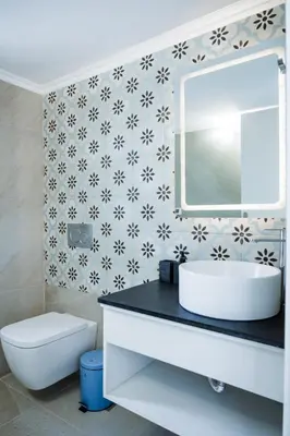 a bathroom with a sink and a mirror at Alcestis City Apartment in Rhodes Town