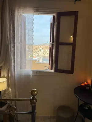 a window in a room with a view at Aeneo Studio 1 in Symi
