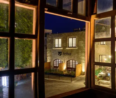a view of a building from a window at Arthur Suites in Old Town in Rhodes Town