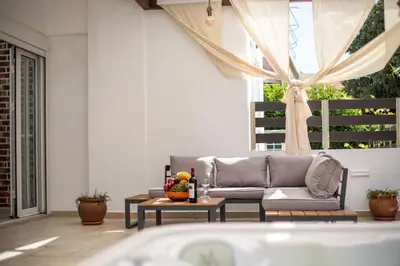 a living room with a couch and a table at La Vie Est Belle in Ixia