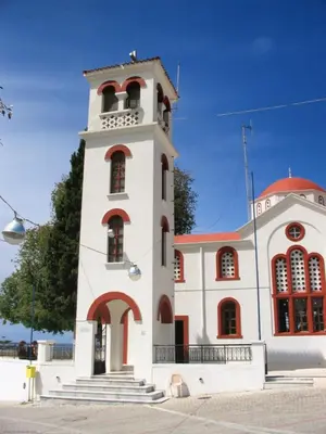 a building with a tower with a staircase in front of it at M&K Traditional House in Theologos