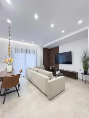 a living room with a couch and a table at AleNi City Apartment 1 in Rhodes Town