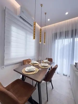 a dining room with a table and chairs at AleNi City Apartment 1 in Rhodes Town
