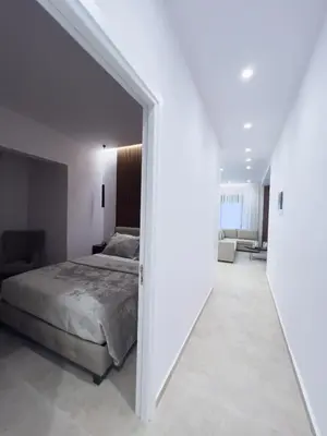 a bedroom with a bed and a hallway at AleNi City Apartment 1 in Rhodes Town