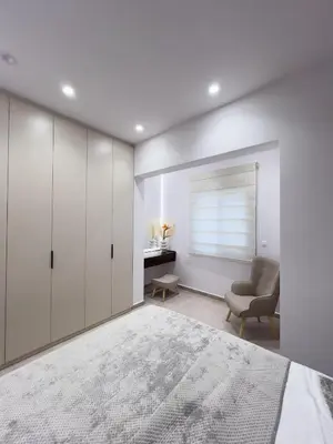 a bedroom with a bed and a chair and a desk at AleNi City Apartment 2 in Rhodes Town