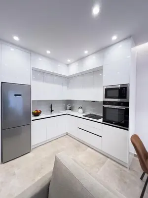 a white kitchen with white cabinets and appliances at AleNi City Apartment 2 in Rhodes Town