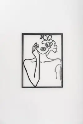 a drawing of a woman with a flower in a frame at Casa di Hari in Afantou