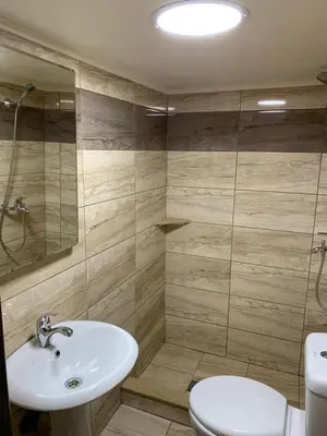 a bathroom with a sink and a toilet at 4 Brothers in Rhodes Town