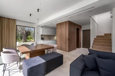 a living room with a table and a couch at Casa Yiava in Ialyssos