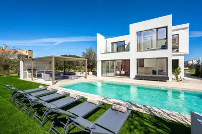 a villa with a swimming pool and lawn at Casa Yiava in Ialyssos