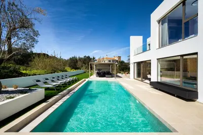 a swimming pool in the backyard of a house at Casa Yiava in Ialyssos