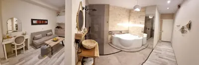a bathroom with a sink and a toilet at Golden City Center Suites in Rhodes Town