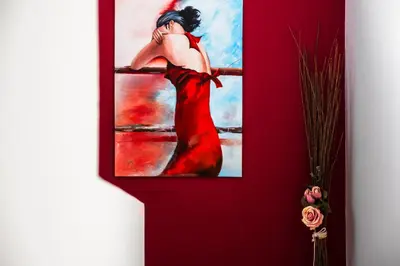 a painting of a woman in a red dress at Atelier 71 in Rhodes Town