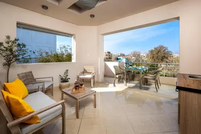 a living room with a couch and a table at Atelier 71 in Rhodes Town