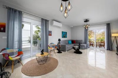 a living room with a couch and chairs at Atelier 71 in Rhodes Town