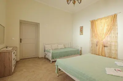 a bedroom with two beds and a window at Aneza in Kremasti