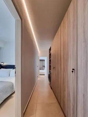 a hallway leading to a bedroom with a bed at AKTI city apartment in Rhodes Town