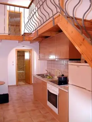 a kitchen with a sink and a stove top oven at Lakis Apartments in Faliraki
