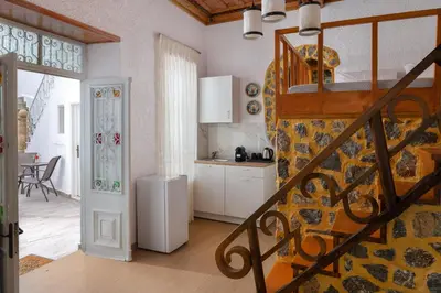 a kitchen and a staircase in a room at Casa Tradizionale in Rhodes Town