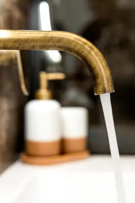 a kitchen sink faucet with a hose coming out at Sirin Luxury Suites Groundfloor in Haraki